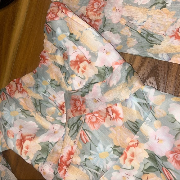 NWOT Floral Long Sleeve Romper with tie in the back and smocked sleeves - Picture 4 of 8